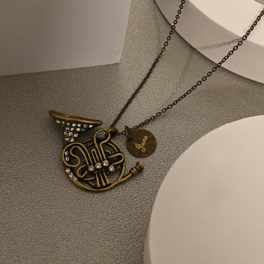 Antique Bronze French Horn Necklace with Engraved Coin